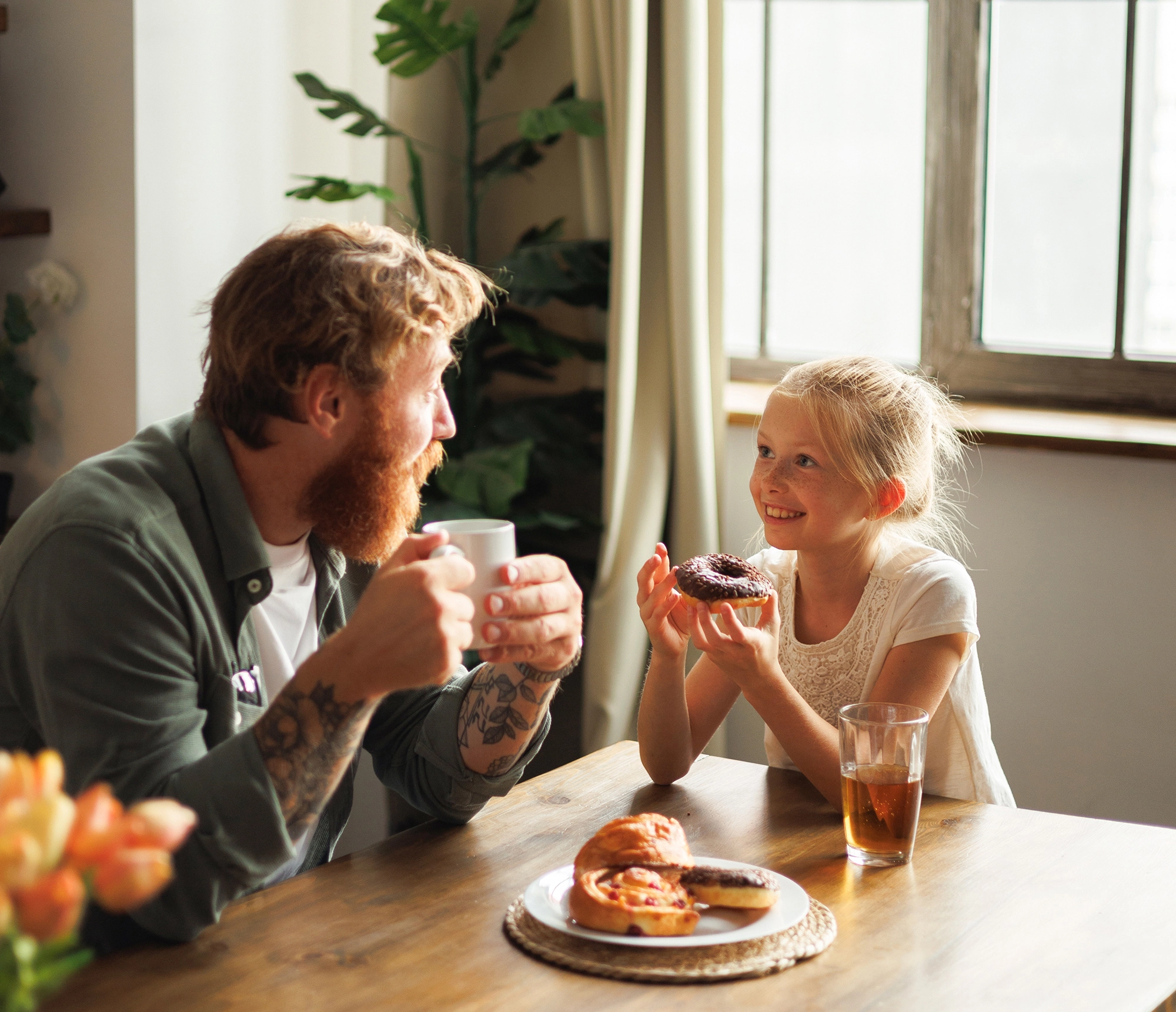 Dad and daughter enjoying breakfast in their new home